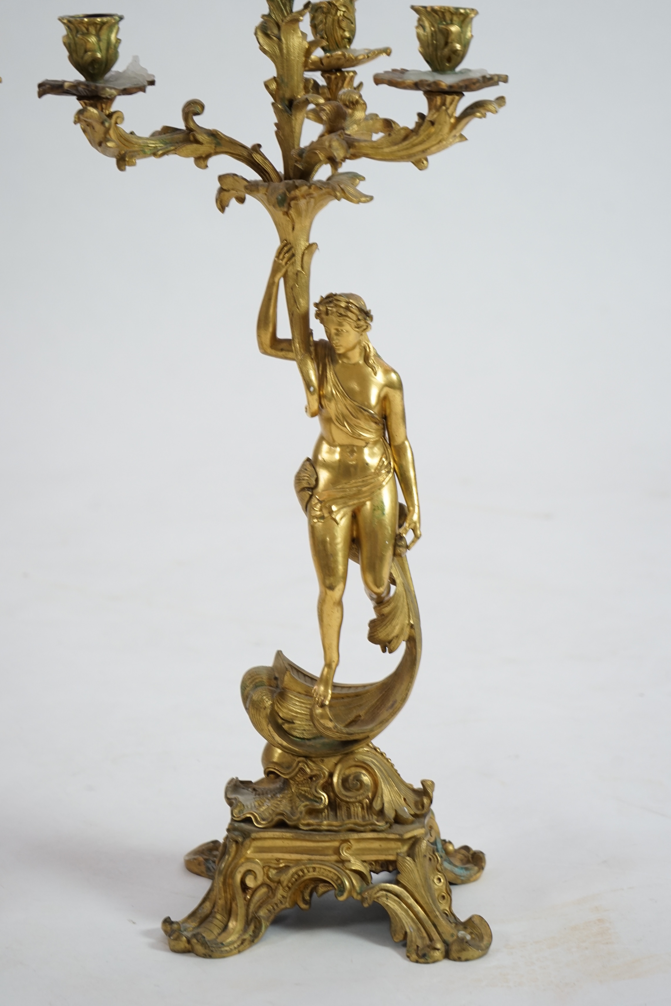 A pair of 19th century French ormolu five light ‘Venus’ figural candelabra